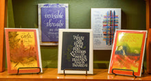 Load image into Gallery viewer, Greeting Cards are 5"x7" and have varied colored borders.  They are blank inside and come in a plastic slip with an envelope