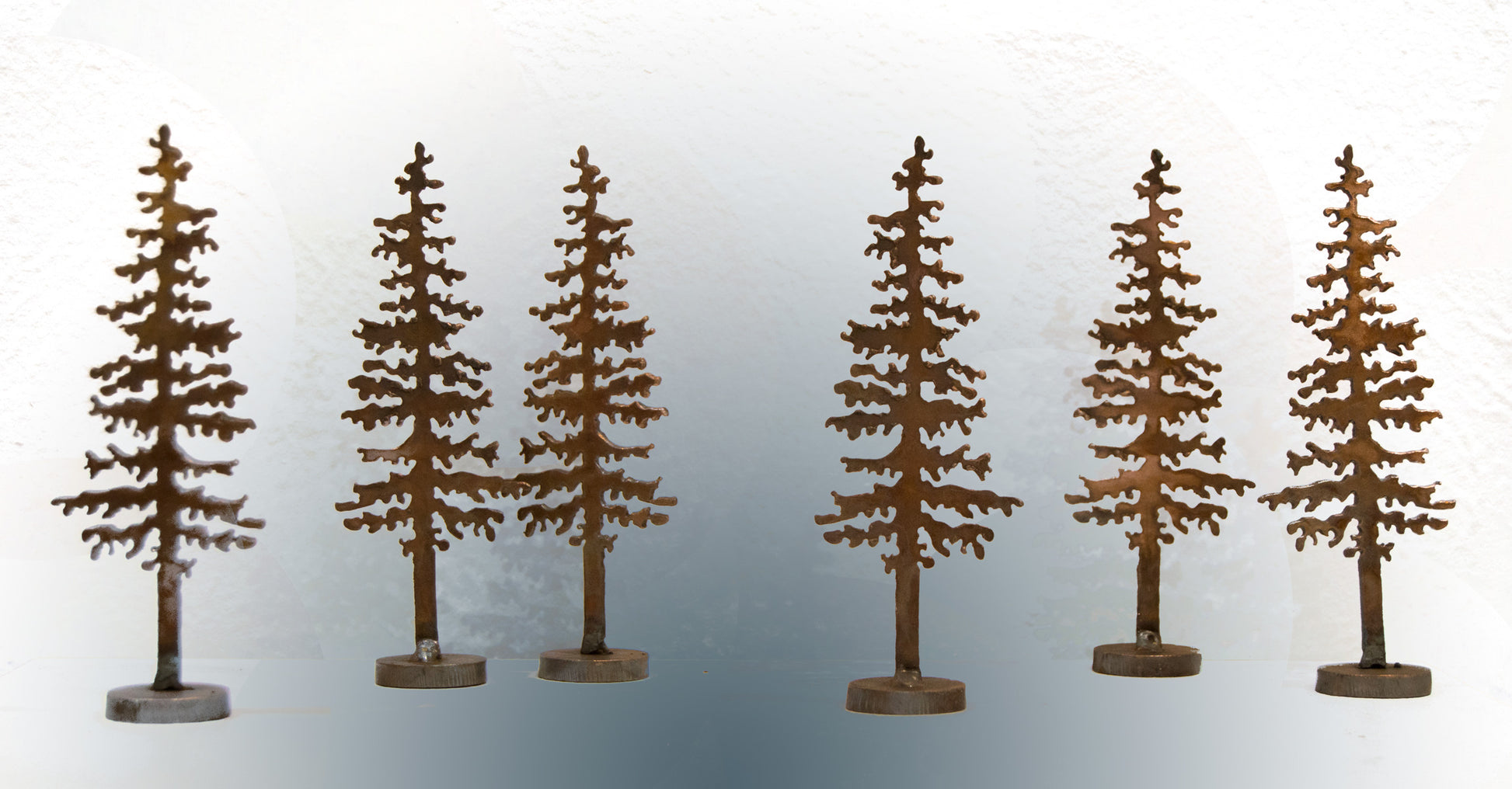 Metal pine tree sculpture by Dave Larson
